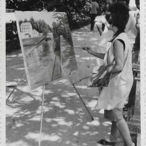Pintora en el Jardín de la Isla pintando el Molino